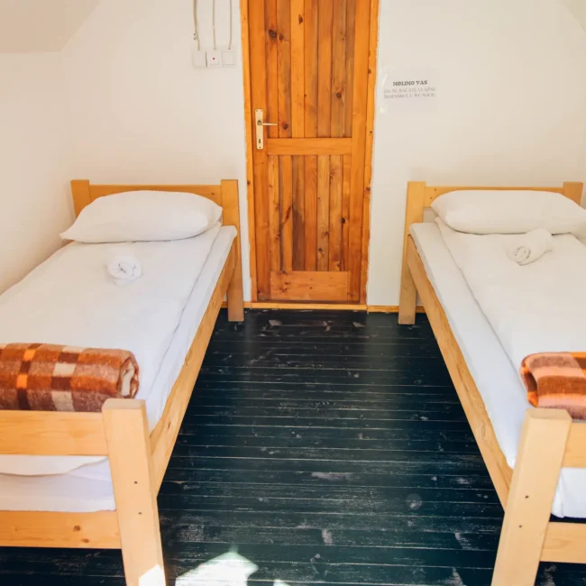 2 cosy, neat wooden beds