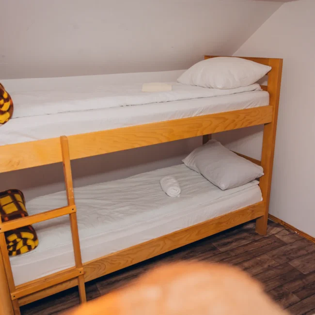 wooden bunk bed with clen, neat sheets