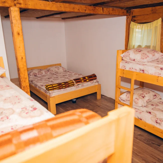 2 sets of wooden bunk beds and wooden bed for 2 people